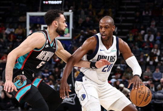 Khris Middleton of the Dallas Mavericks handles the ball against Tyler Burton of the Memphis Grizzlies during the first half at FedExForum on March 12, 2026.