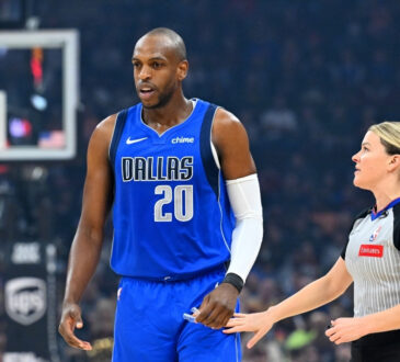 Khris Middleton talks with referee Jenna Schroeder during the first quarter of the Mavericks’ game against the Cleveland Cavaliers at Rocket Mortgage FieldHouse on March 15, 2026.