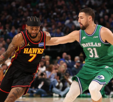 Klay Thompson defends Atlanta guard Nickeil Alexander‑Walker during the Mavericks’ game against the Hawks on March 18, 2026, at American Airlines Center.