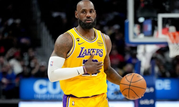 LeBron James #23 of the Los Angeles Lakers dribbles the ball against the Detroit Pistons at Little Caesars Arena on March 23, 2026.