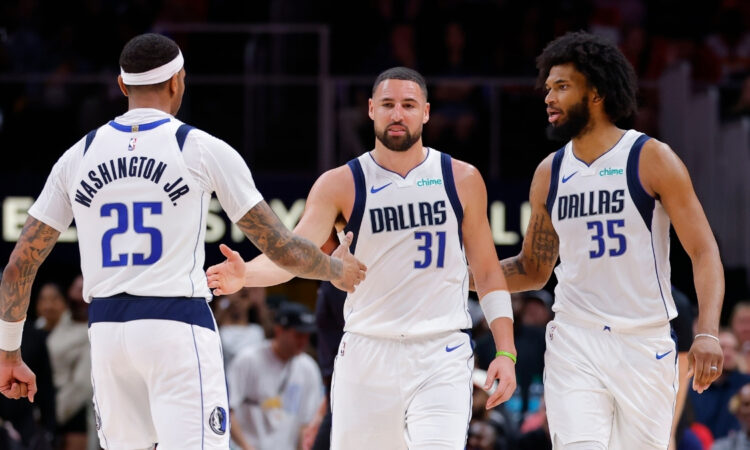 P.J. Washington, Klay Thompson and Marvin Bagley III react during the Mavericks’ game against the Hawks at State Farm Arena on March 10, 2026.