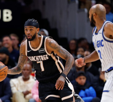 Nickeil Alexander-Walker drives against Jevon Carter during Hawks vs. Magic on March 16, 2026 at State Farm Arena.