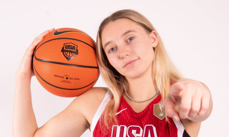 Paige Bueckers holds a basketball while posing in her USA Basketball uniform ahead of the 2026 FIBA Women's World Cup Qualifying Tournament in Puerto Rico.