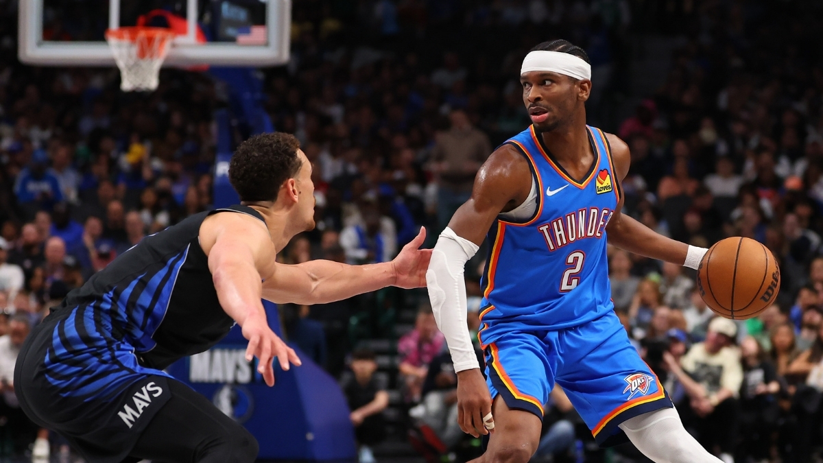 NBA: Shai Gilgeous-Alexander drives to the basket while defended by Dwight Powell at American Airlines Center during Thunder vs. Mavericks.