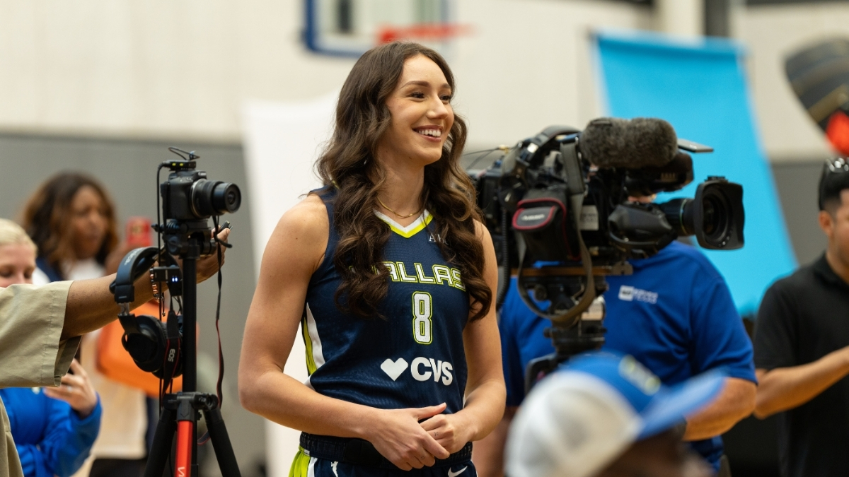 Dallas Wings forward Alanna Smith asks a question to teammate Alysha Clark during a media availability session.