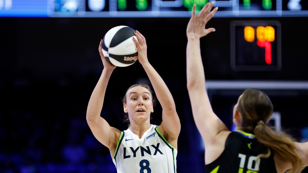 Alanna Smith #8 of the Minnesota Lynx looks to pass the ball while guarded by the Dallas Wings at College Park Center.