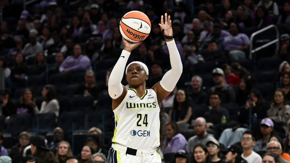 Arike Ogunbowale #24 of the Dallas Wings shoots a jump shot against the Golden State Valkyries at Chase Center.