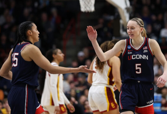 UConn guards Azzi Fudd and Paige Bueckers react during the second half of their Elite Eight victory over the USC Trojans in Spokane.