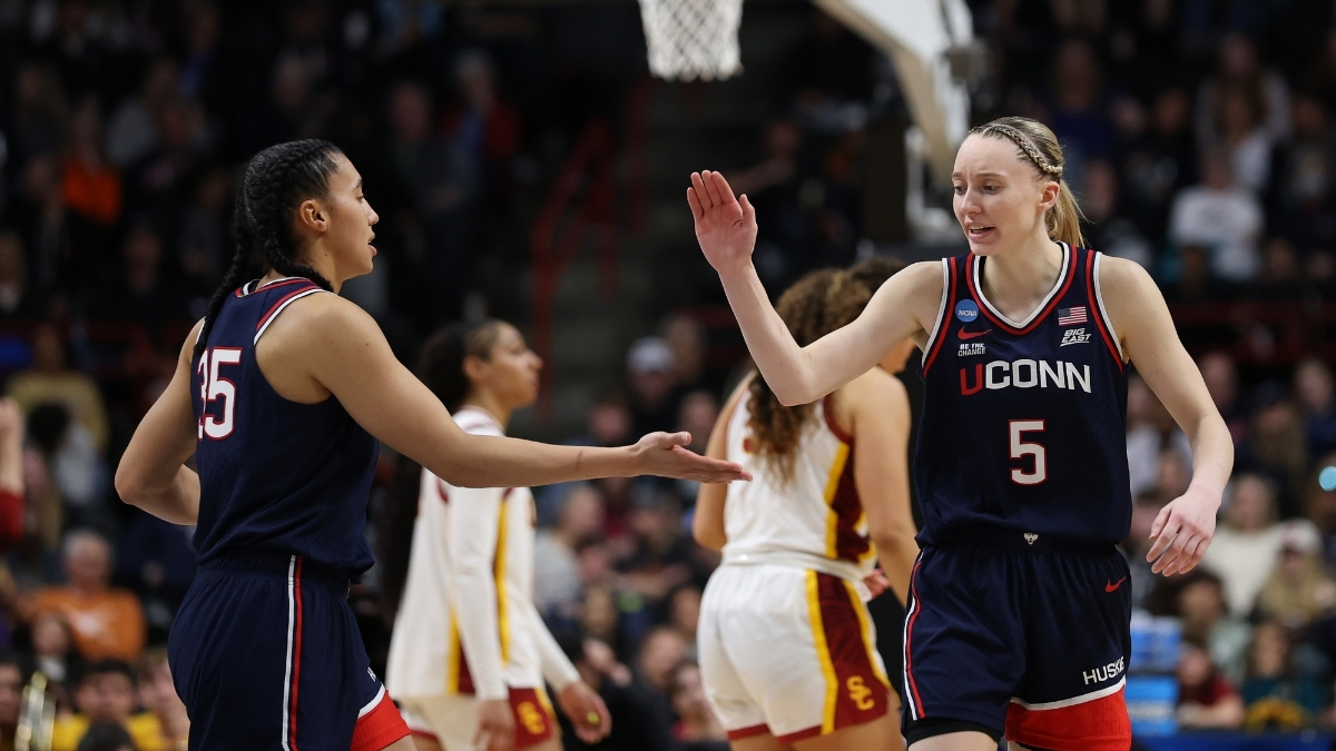 UConn guards Azzi Fudd and Paige Bueckers react during the second half of their Elite Eight victory over the USC Trojans in Spokane.