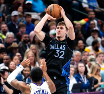 Cooper Flagg #32 of the Dallas Mavericks shooting a jump shot over Rui Hachimura #28 of the Los Angeles Lakers at American Airlines Center.