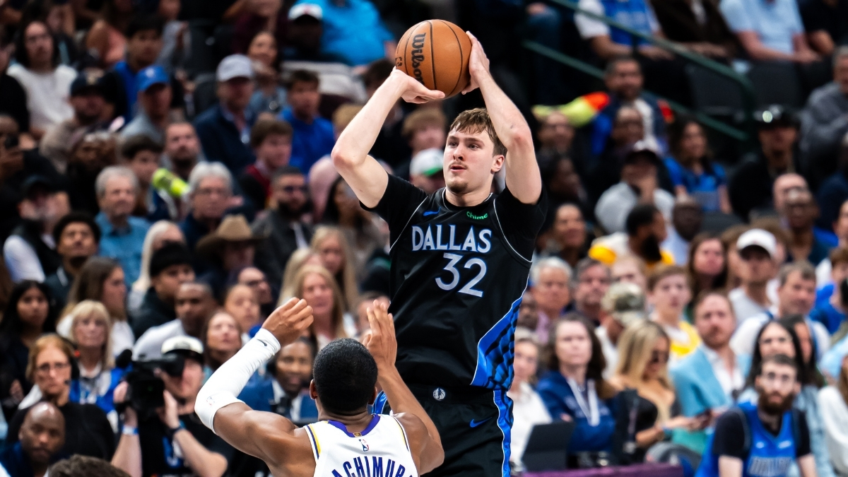 Cooper Flagg #32 of the Dallas Mavericks shooting a jump shot over Rui Hachimura #28 of the Los Angeles Lakers at American Airlines Center.