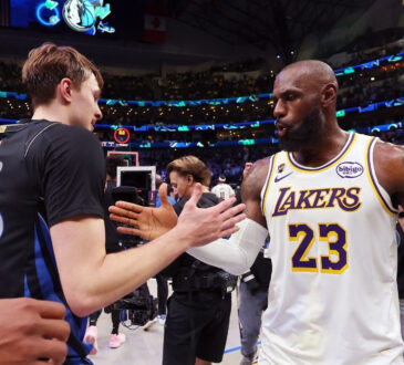 Cooper Flagg #32 of the Dallas Mavericks shakes hands with LeBron James #23 of the Los Angeles Lakers after a Mavericks win at American Airlines Center on April 5, 2026 in Dallas, Texas.