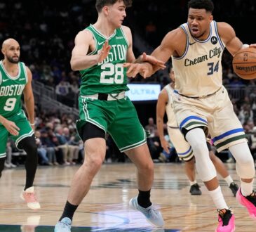 Giannis Antetokounmpo #34 of the Milwaukee Bucks dribbles against Hugo González #28 of the Boston Celtics at Fiserv Forum on March 02, 2026.