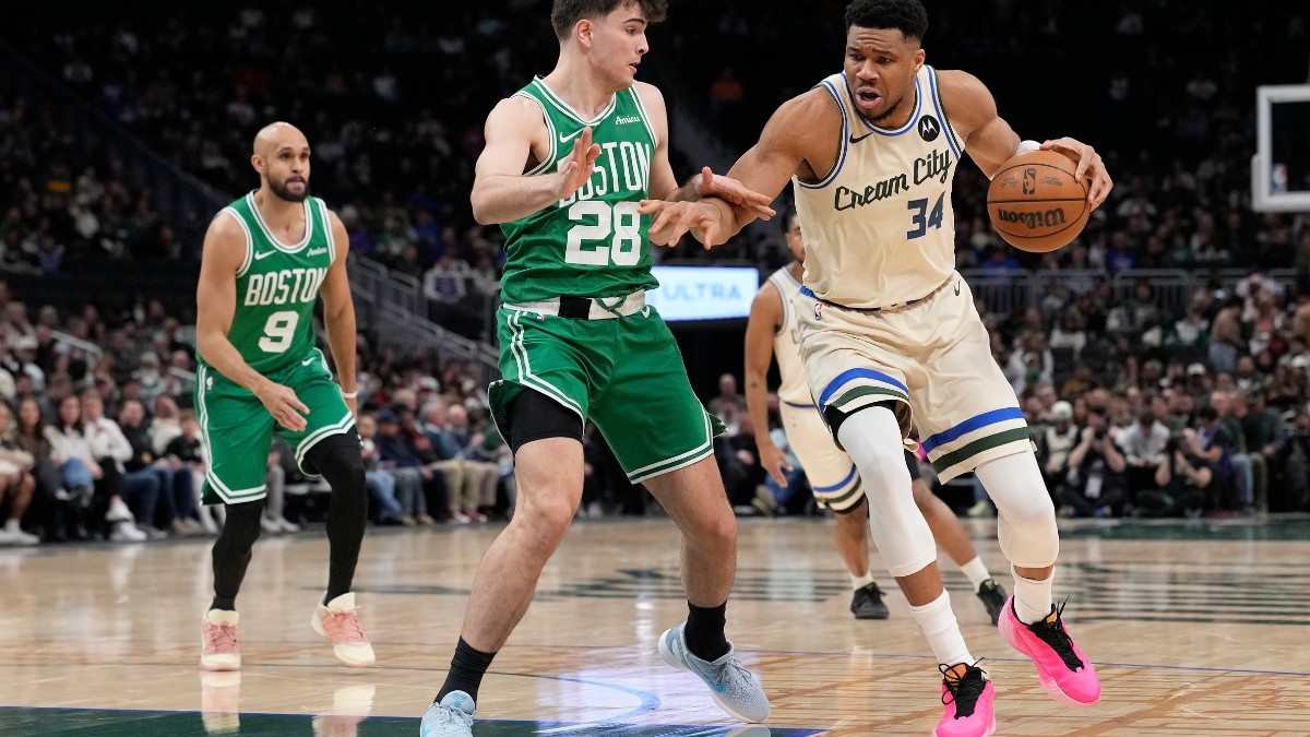 Giannis Antetokounmpo #34 of the Milwaukee Bucks dribbles against Hugo González #28 of the Boston Celtics at Fiserv Forum on March 02, 2026.
