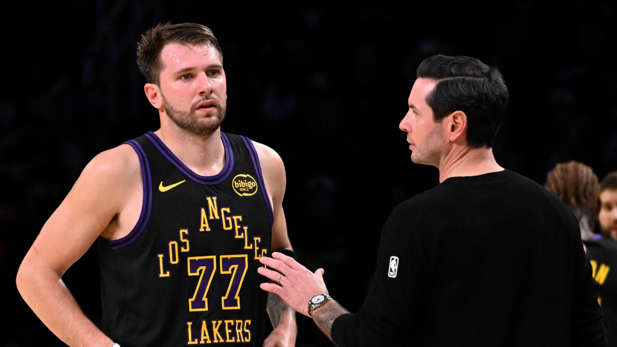 Los Angeles Lakers head coach JJ Redick talks with Luka Doncic #77 during a game against the Utah Jazz at Crypto.com Arena on November 18, 2025.