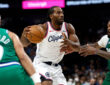 Kawhi Leonard #2 of the Los Angeles Clippers drives to the basket against Naji Marshall #13 of the Dallas Mavericks during overtime at American Airlines Center.