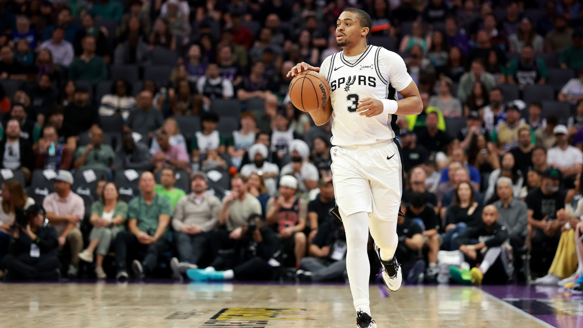 Keldon Johnson #3 of the San Antonio Spurs dribbles the ball during a game against the Sacramento Kings at Golden 1 Center on March 17, 2026.