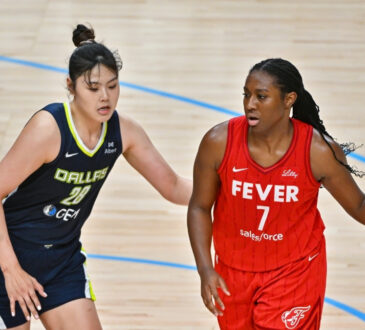 Dallas Wings center Li Yueru defends Indiana Fever center Aliyah Boston in the post during a game at American Airlines Center.