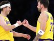 Luka Doncic #77 and Austin Reaves #15 of the Los Angeles Lakers during a timeout against the Chicago Bulls at Crypto.com Arena on March 12, 2026.