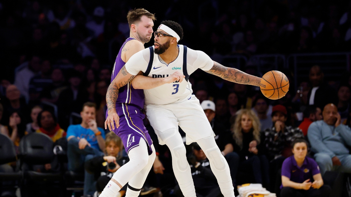 Luka Doncic #77 of the Los Angeles Lakers guards Anthony Davis #3 of the Dallas Mavericks at Crypto.com Arena on November 28, 2025.