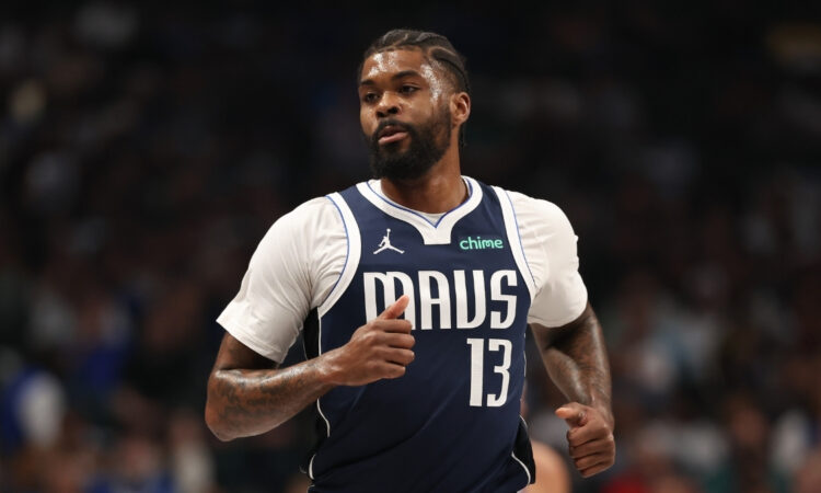 Naji Marshall #13 of the Dallas Mavericks runs up the court during a home game against the Golden State Warriors at American Airlines Center.