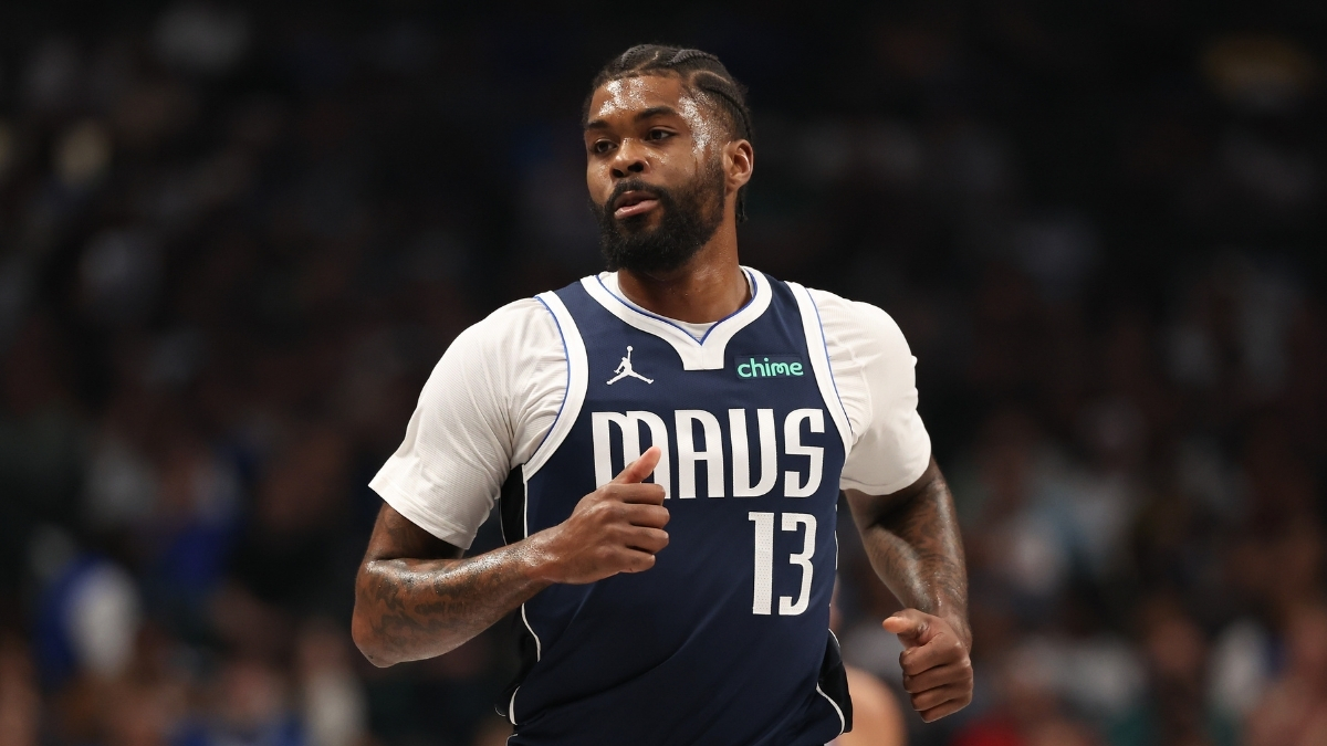 Naji Marshall #13 of the Dallas Mavericks runs up the court during a home game against the Golden State Warriors at American Airlines Center.