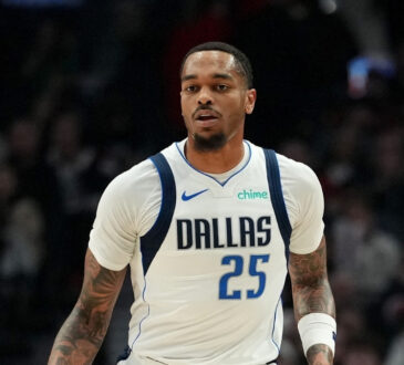 P.J. Washington #25 of the Dallas Mavericks dribbles against the Portland Trail Blazers during the first half at Moda Center on March 27, 2026.