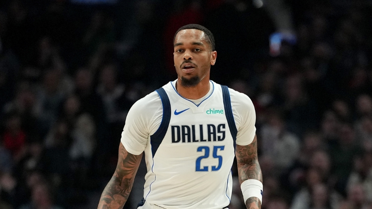 P.J. Washington #25 of the Dallas Mavericks dribbles against the Portland Trail Blazers during the first half at Moda Center on March 27, 2026.