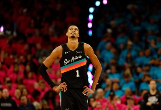 Victor Wembanyama #1 of the San Antonio Spurs looks at the clock during Game 1 of the Western Conference First Round against the Portland Trail Blazers at Frost Bank Center on April 19, 2026.