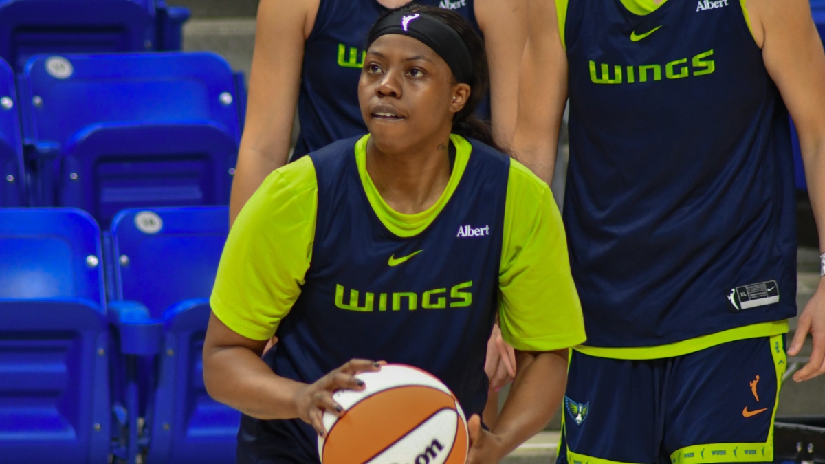 Arike Ogunbowale handles the ball during a 5-on-5 drill at Dallas Wings practice.