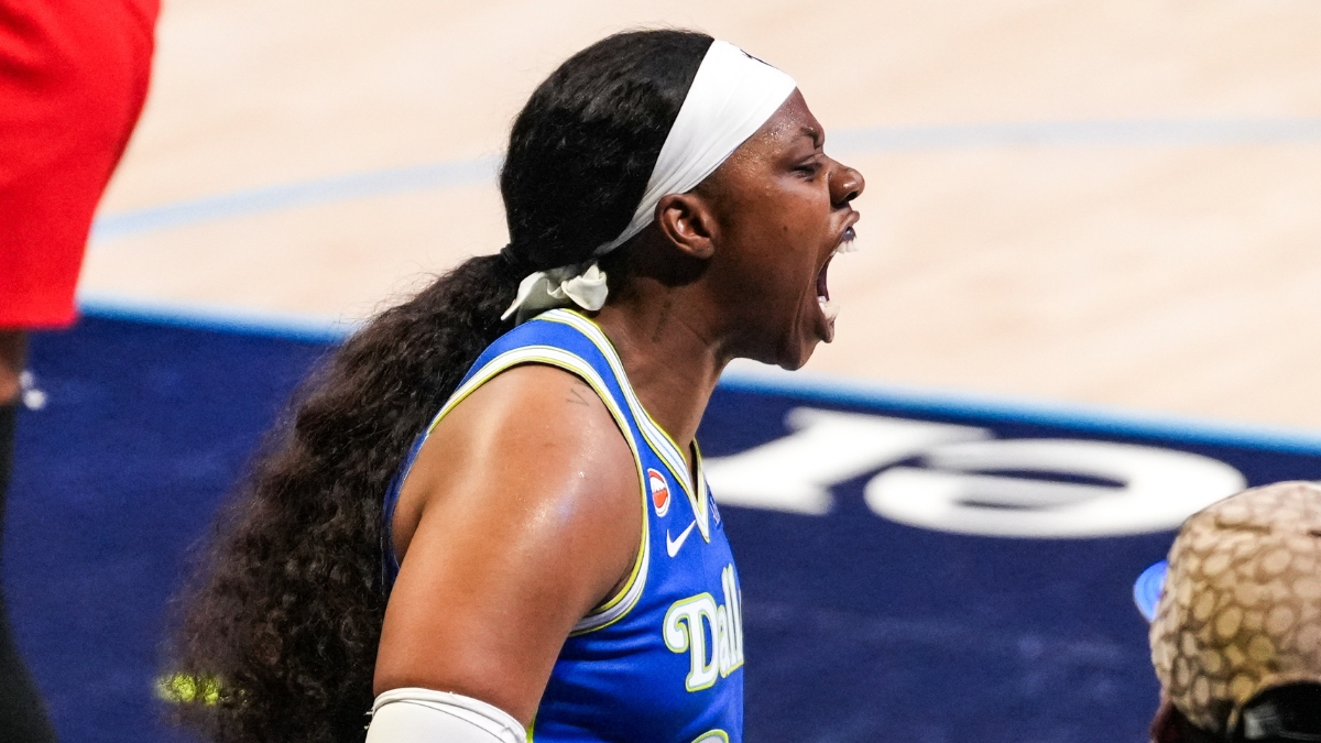 Arike Ogunbowale of the Dallas Wings roaring toward the sellout crowd at College Park Center during the home opener.
