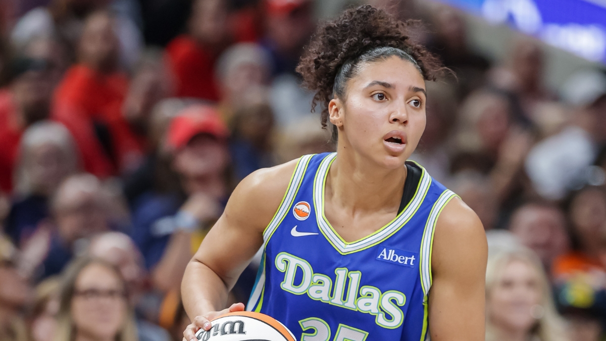 Azzi Fudd (35) of the Dallas Wings looks to make a play during her WNBA regular-season debut against the Indiana Fever.