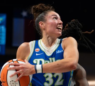Center Jessica Shepard lowering her shoulder to drive hard down the lane, exploding past her defender toward the rim.