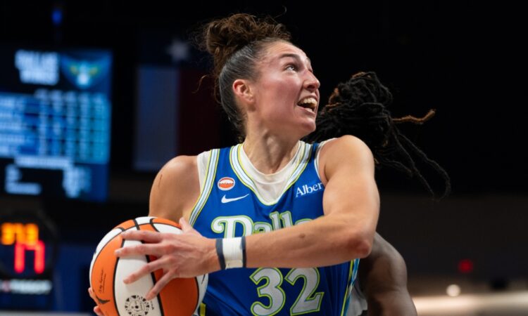 Center Jessica Shepard lowering her shoulder to drive hard down the lane, exploding past her defender toward the rim.