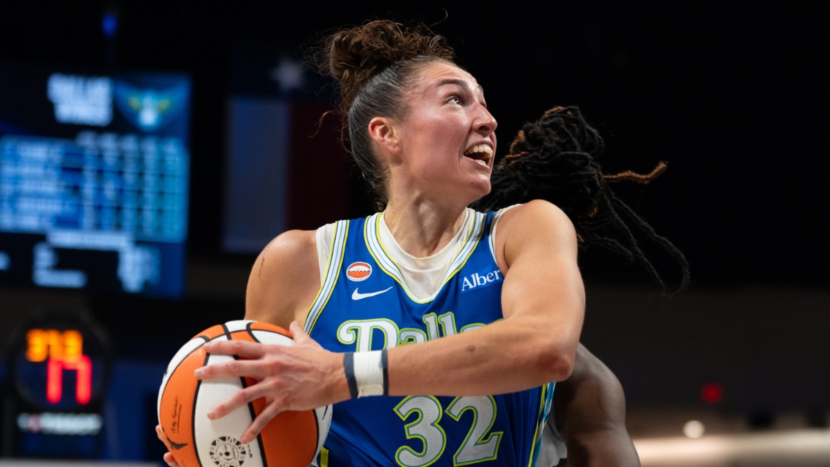 Center Jessica Shepard lowering her shoulder to drive hard down the lane, exploding past her defender toward the rim.