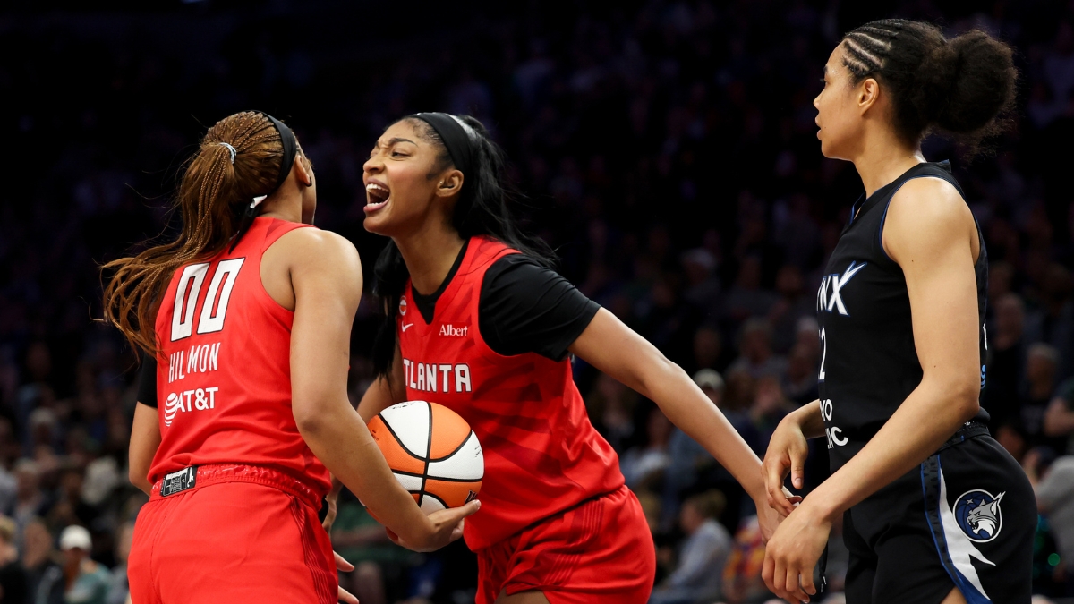 Naz Hillmon (00) of the Atlanta Dream celebrates with Angel Reese (5) during the fourth quarter against the Minnesota Lynx at Target Center.