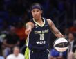Dallas Wings guard Aziaha James controls the ball against the Seattle Storm