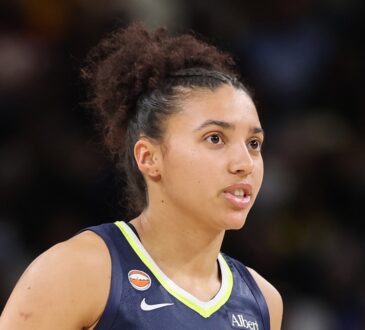 Dallas Wings rookie guard Azzi Fudd (#35) looking on from the court during the second half of a game against the Chicago Sky at Wintrust Arena.