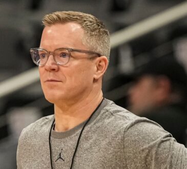 Dusty May, hired as Dallas Mavericks head coach, looks on during a Michigan practice at the NCAA Tournament