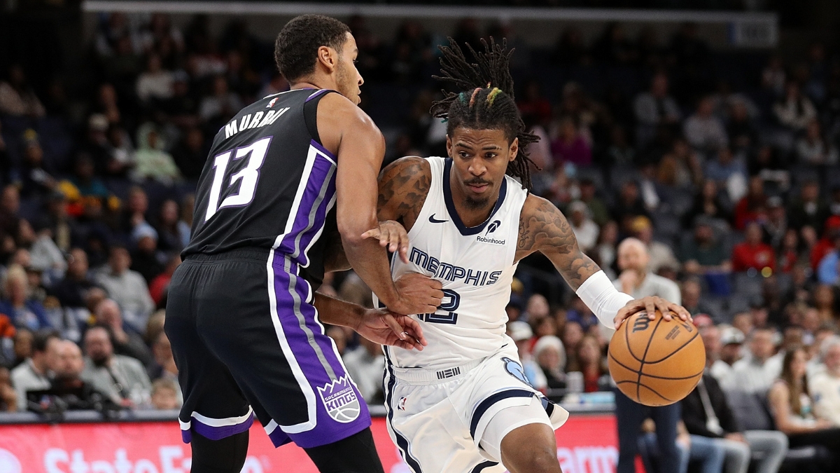 Ja Morant, a Kings trade target, drives to the basket against Sacramento's Keegan Murray