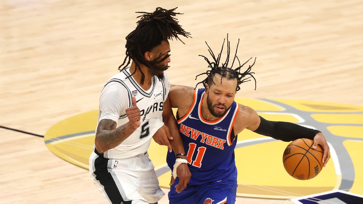 Jalen Brunson of the New York Knicks dribbles against Stephon Castle of the San Antonio Spurs during Game 2 of the 2026 NBA Finals.