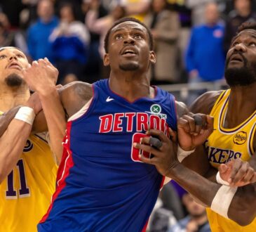 Detroit Pistons center Jalen Duren battles for position between Los Angeles Lakers center Jaxson Hayes and center Deandre Ayton during the second half at Little Caesars Arena