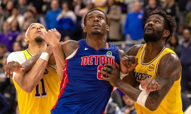 Detroit Pistons center Jalen Duren battles for position between Los Angeles Lakers center Jaxson Hayes and center Deandre Ayton during the second half at Little Caesars Arena