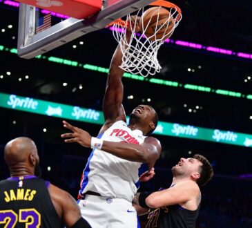 Detroit Pistons center Jalen Duren dunks against Los Angeles Lakers forward LeBron James and guard Luka Doncic during the first half at Crypto.com Arena.