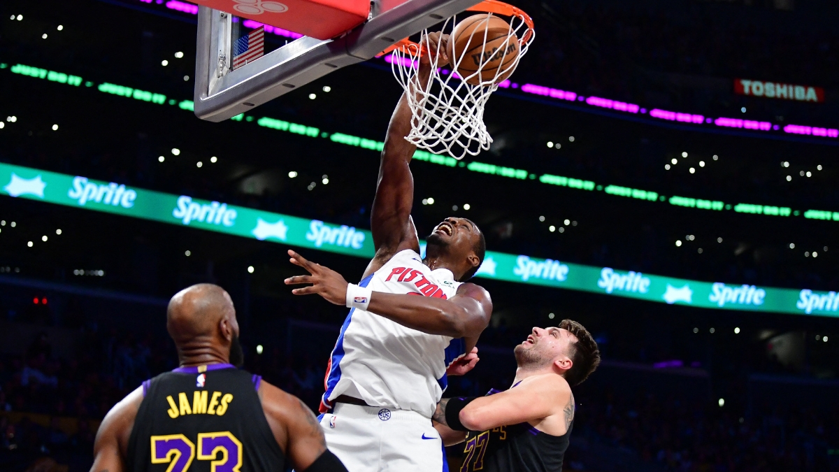 Detroit Pistons center Jalen Duren dunks against Los Angeles Lakers forward LeBron James and guard Luka Doncic during the first half at Crypto.com Arena.