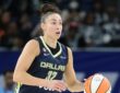 Jessica Shepard dribbles up the court for the Dallas Wings against the Chicago Sky.