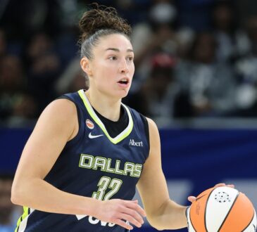 Jessica Shepard dribbles up the court for the Dallas Wings against the Chicago Sky.