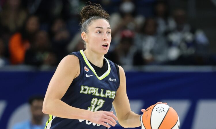 Jessica Shepard dribbles up the court for the Dallas Wings against the Chicago Sky.