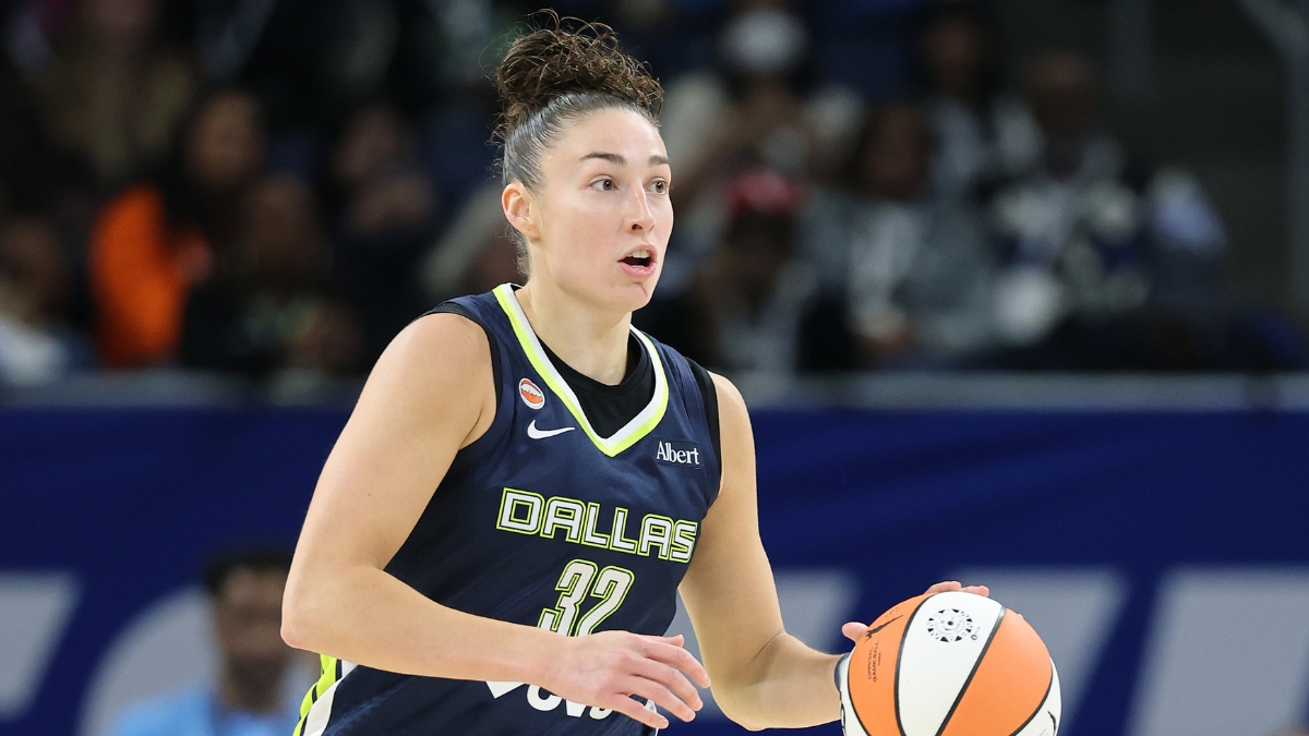 Jessica Shepard dribbles up the court for the Dallas Wings against the Chicago Sky.