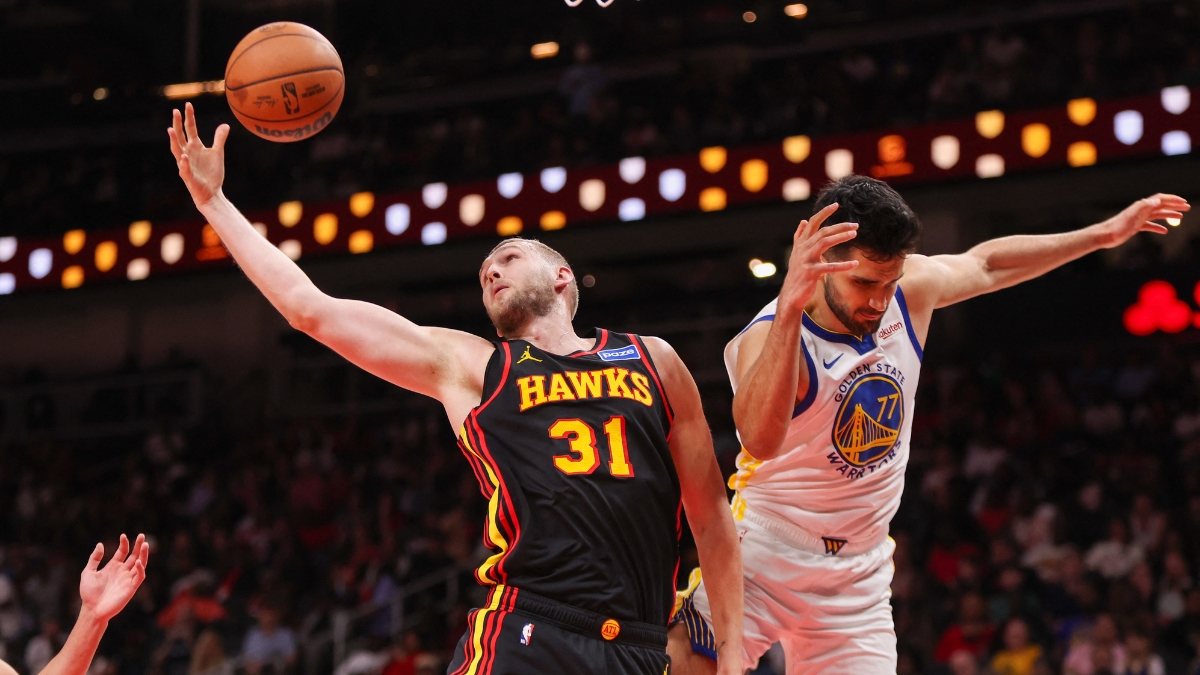Atlanta Hawks center Jock Landale grabs a rebound past Golden State Warriors center Omer Yurtseven at State Farm Arena.
